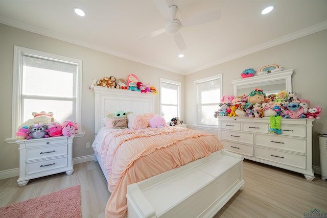 bedroom featuring ceiling fan, light hardwood / wood-style flooring, and ornamental molding