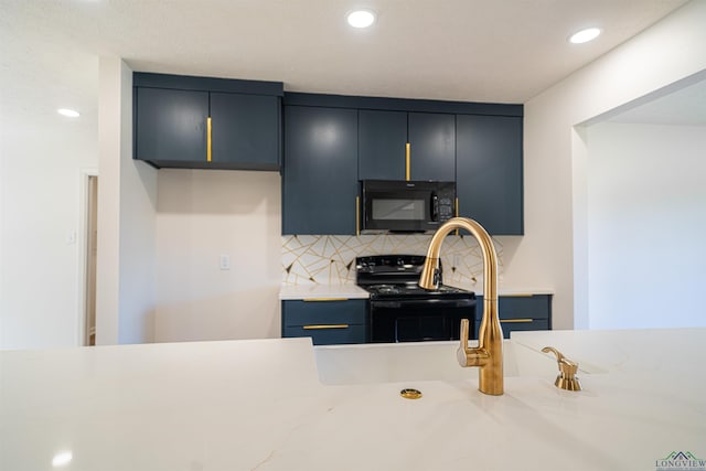 kitchen with tasteful backsplash, blue cabinetry, sink, and stainless steel electric range