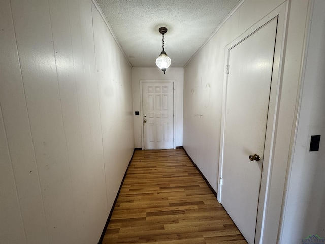 1258 County Road 4202, Daingerfield, TX 75638 - corridor with crown molding, a textured ceiling, and wood finished floors