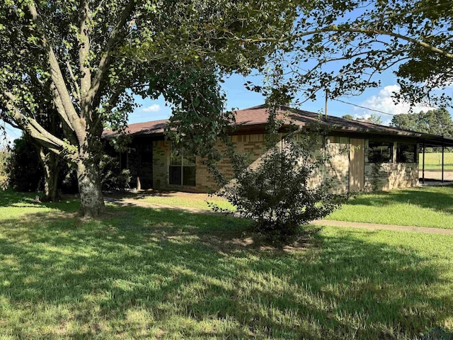 exterior space with a lawn