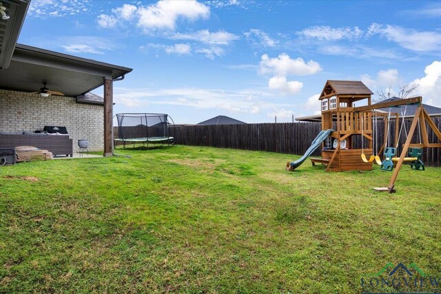 204 Nolan Farms, Winona, TX 75792 - view of yard featuring a trampoline and a playground