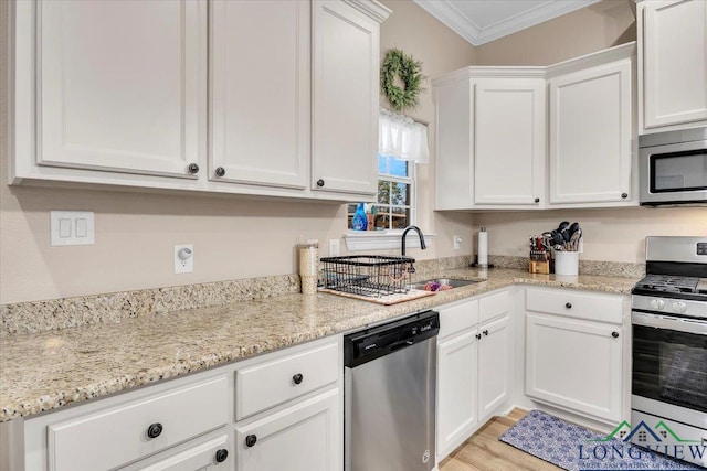 204 Nolan Farms, Winona, TX 75792 - kitchen with appliances with stainless steel finishes, light stone countertops, white cabinets, crown molding, and sink