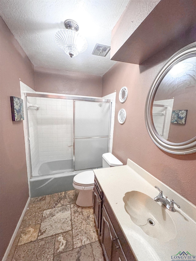 300 Delwood Dr, Longview, TX 75605 - bathroom featuring a textured ceiling, visible vents, stone finish flooring, toilet, and vanity