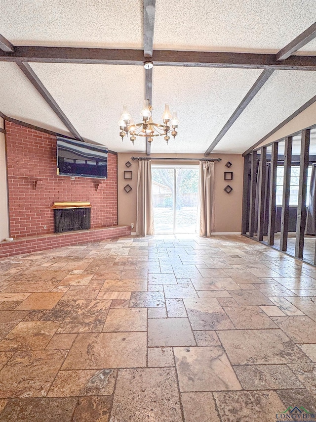 300 Delwood Dr, Longview, TX 75605 - unfurnished living room with lofted ceiling with beams, a textured ceiling, a fireplace, stone tile flooring, and a notable chandelier