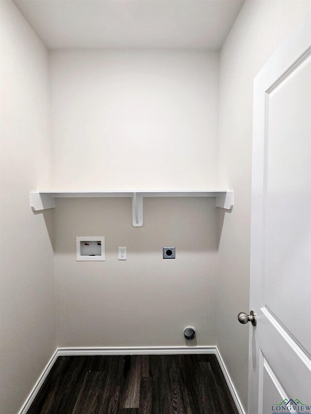 washroom with dark wood finished floors, hookup for an electric dryer, laundry area, baseboards, and hookup for a washing machine