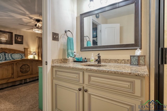 bathroom featuring ceiling fan and vanity