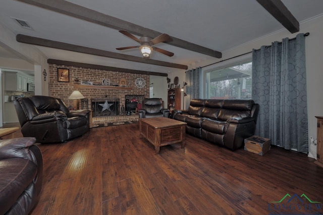 living room featuring beamed ceiling, a fireplace, dark hardwood / wood-style flooring, and ceiling fan