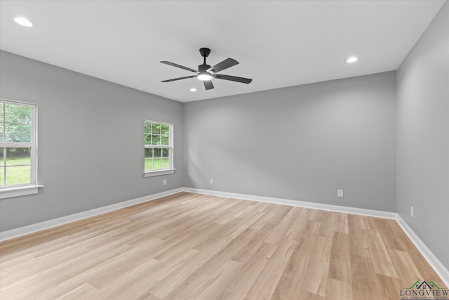 empty room featuring baseboards, recessed lighting, light wood-style floors, and ceiling fan