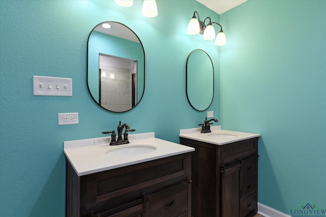 bathroom featuring two vanities and a sink