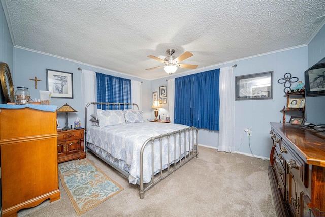 carpeted bedroom featuring a textured ceiling, ceiling fan, and crown molding