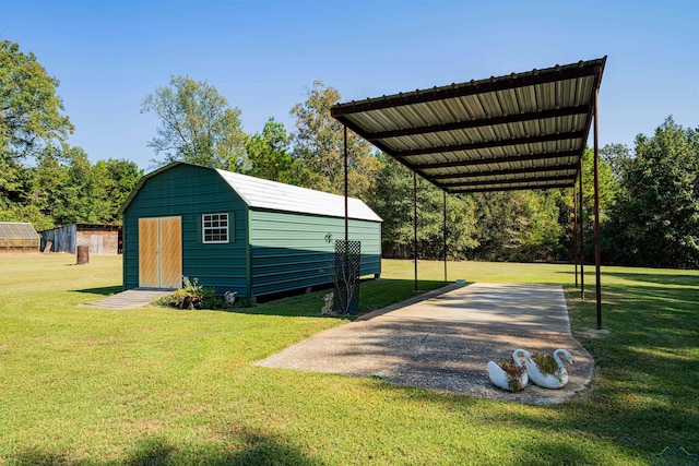 view of outbuilding featuring a yard and a carport