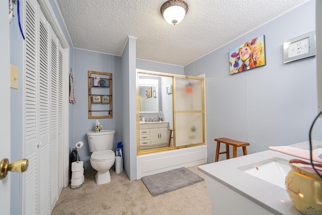 full bathroom featuring a textured ceiling, vanity, toilet, and enclosed tub / shower combo