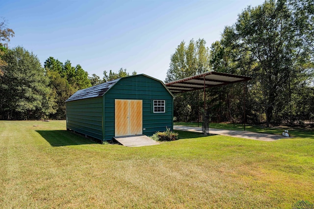 view of outdoor structure featuring a lawn