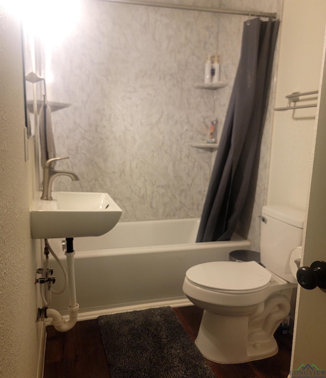 414 E Main St, Omaha, TX 75571 - bathroom featuring wood finished floors, shower / tub combo, and toilet