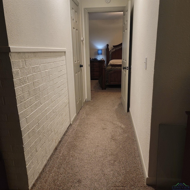 414 E Main St, Omaha, TX 75571 - hallway featuring light carpet and baseboards