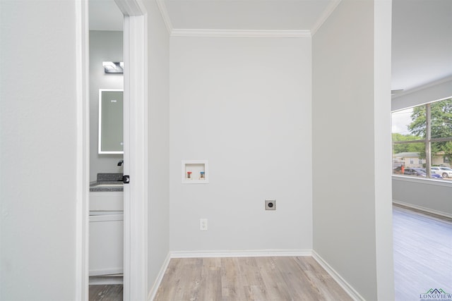 100 Dickson Ct, Kilgore, TX 75662 - laundry room with electric dryer hookup, washer hookup, light wood-type flooring, crown molding, and baseboards
