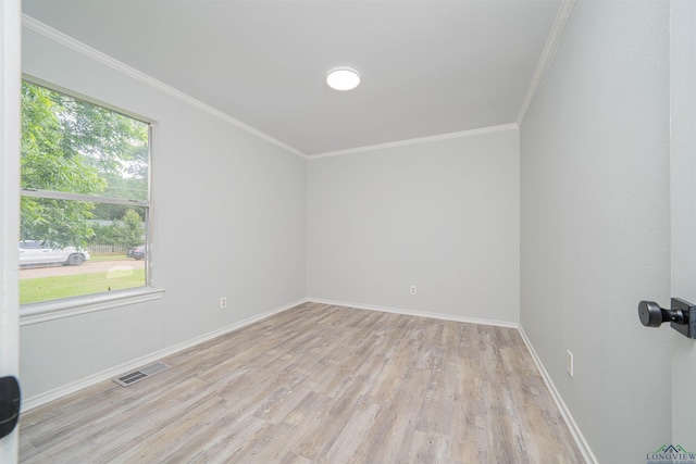 100 Dickson Ct, Kilgore, TX 75662 - spare room featuring ornamental molding, wood finished floors, and baseboards