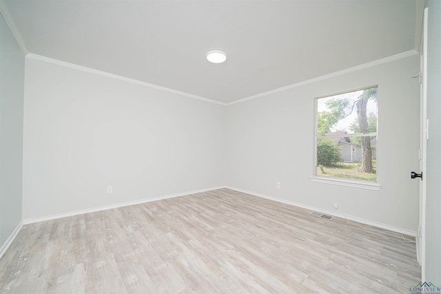 100 Dickson Ct, Kilgore, TX 75662 - spare room with crown molding, light wood-style flooring, and baseboards