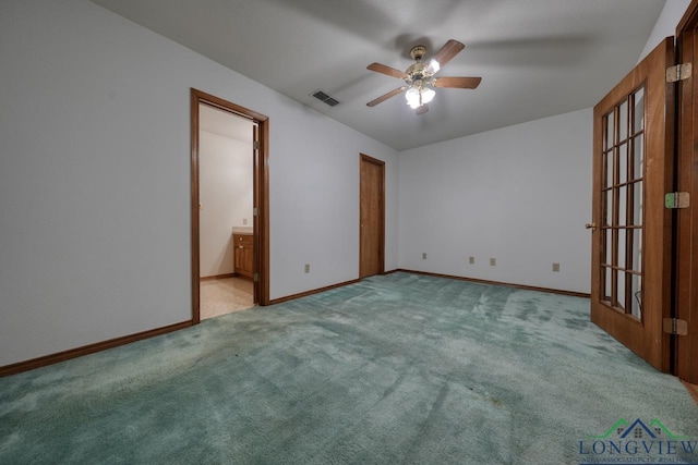 empty room with light carpet and ceiling fan