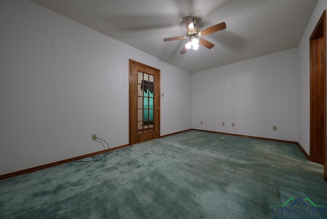 spare room with ceiling fan and carpet