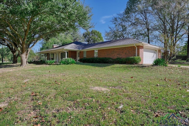 ranch-style home with a garage and a front yard