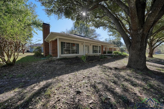 ranch-style house with covered porch