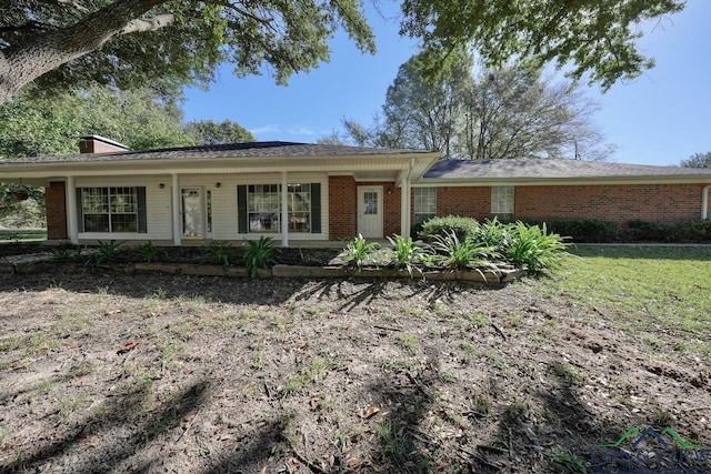 ranch-style home featuring a porch