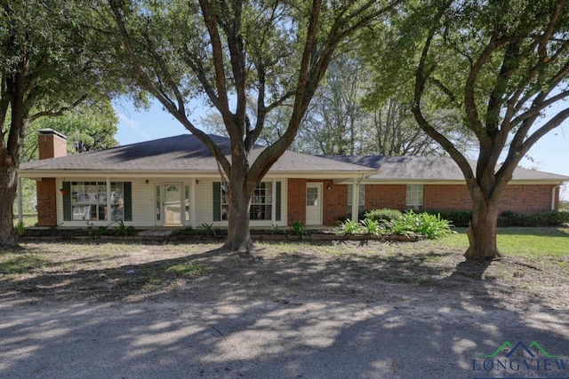 ranch-style home featuring a porch