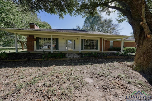 ranch-style home featuring covered porch