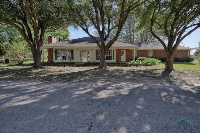 single story home featuring covered porch