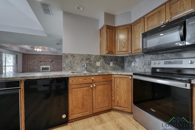 kitchen featuring tasteful backsplash, ceiling fan, sink, and black appliances