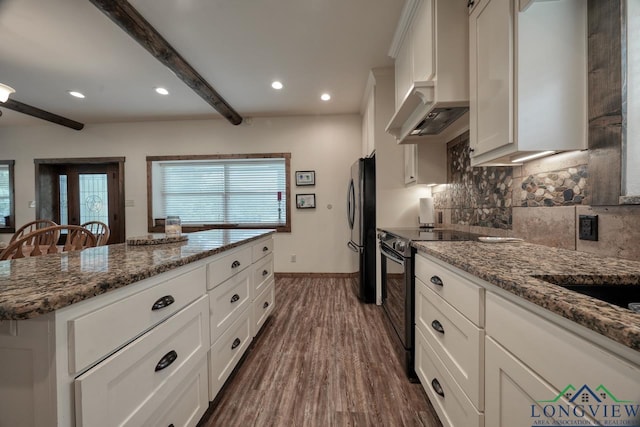 16272 County Road 223, Arp, TX 75750 - kitchen with freestanding refrigerator, custom range hood, black electric range oven, tasteful backsplash, and a center island