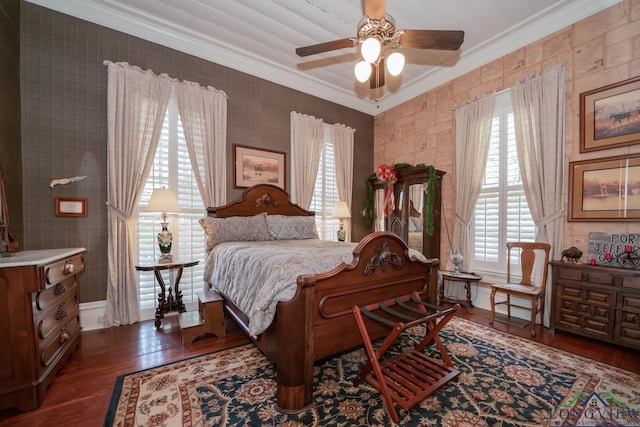 bedroom featuring ceiling fan, crown molding, and dark wood-type flooring