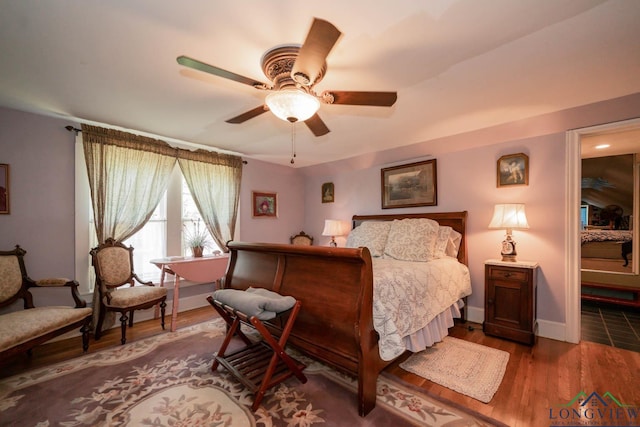 bedroom featuring hardwood / wood-style flooring and ceiling fan