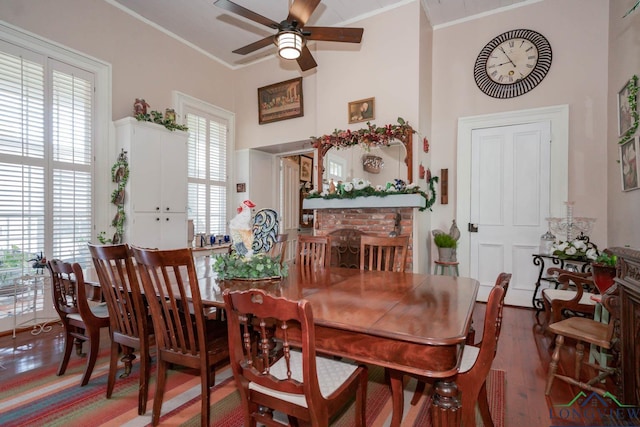 dining area featuring hardwood / wood-style floors, ceiling fan, and crown molding