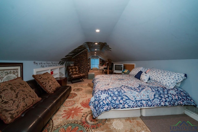 bedroom with lofted ceiling