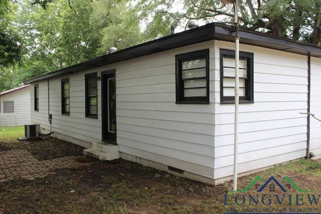 1212 N Edwards St, Gladewater, TX 75647 - view of property exterior featuring entry steps, central air condition unit, and crawl space