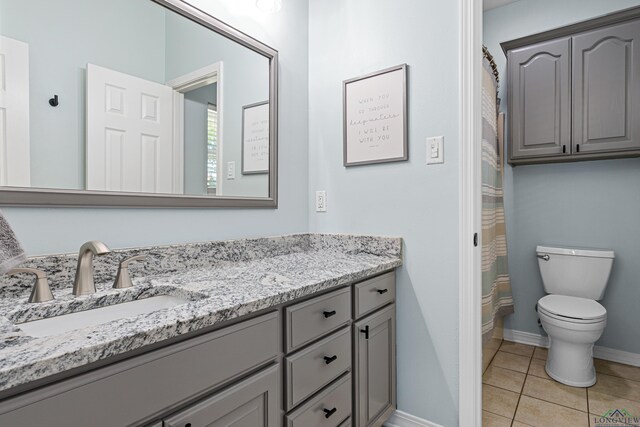 215 Sugar Creek Ln, Longview, TX 75605 - full bathroom with vanity, toilet, tile patterned flooring, baseboards, and curtained shower