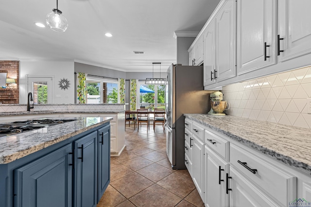 215 Sugar Creek Ln, Longview, TX 75605 - kitchen featuring white cabinets, plenty of natural light, backsplash, crown molding, and a sink