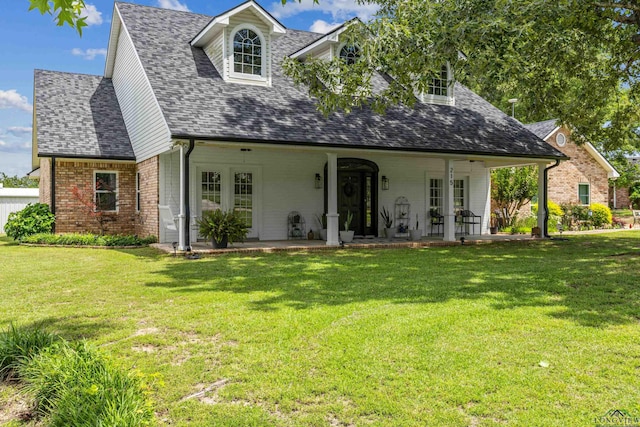 215 Sugar Creek Ln, Longview, TX 75605 - cape cod home with a front yard, roof with shingles, and brick siding