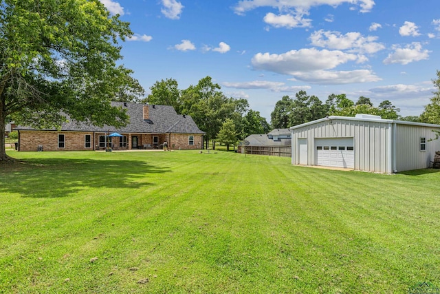 215 Sugar Creek Ln, Longview, TX 75605 - view of yard with a detached garage and an outbuilding