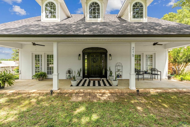 215 Sugar Creek Ln, Longview, TX 75605 - property entrance with roof with shingles, a ceiling fan, and a porch