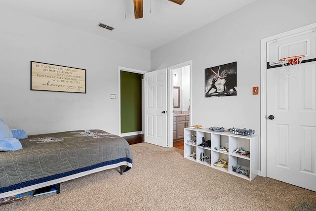 215 Sugar Creek Ln, Longview, TX 75605 - bedroom featuring light carpet, a ceiling fan, ensuite bathroom, and baseboards