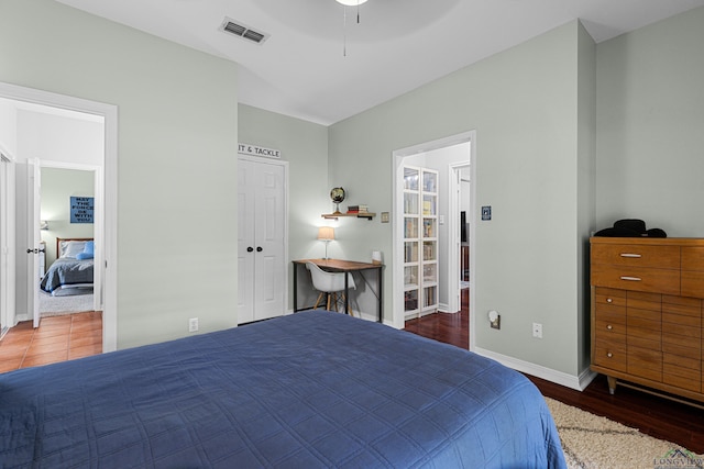 215 Sugar Creek Ln, Longview, TX 75605 - bedroom with wood finished floors, baseboards, and a ceiling fan