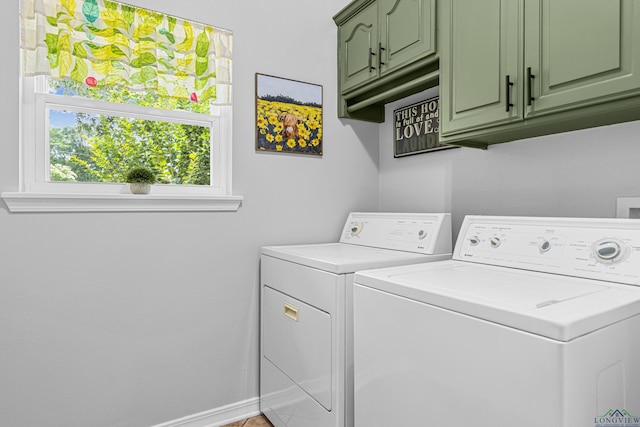 215 Sugar Creek Ln, Longview, TX 75605 - laundry area featuring cabinet space, washer and clothes dryer, and baseboards