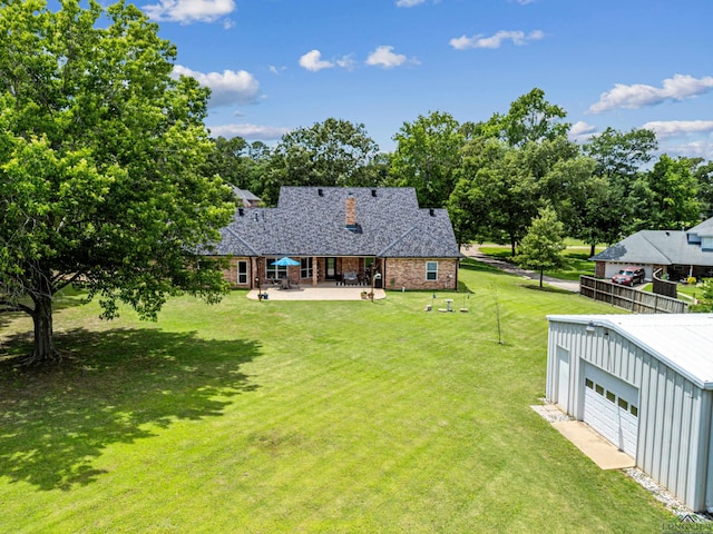 215 Sugar Creek Ln, Longview, TX 75605 - view of green lawn featuring a patio area and an outbuilding