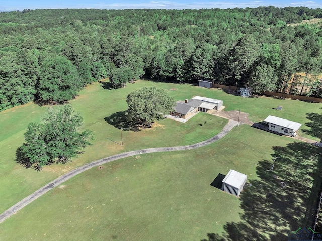 view of property location featuring a heavily wooded area