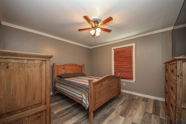 bedroom with wood finished floors, a ceiling fan, and baseboards