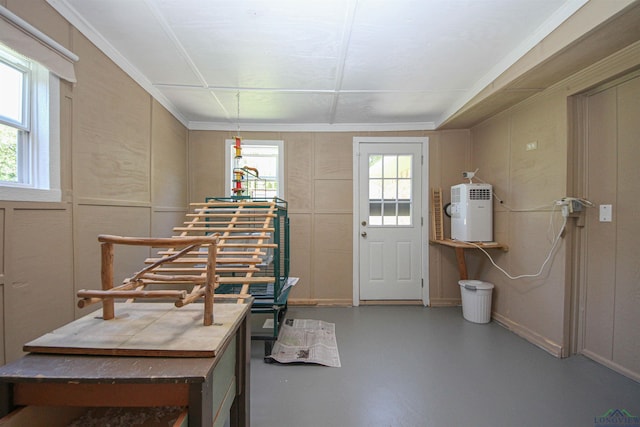 foyer featuring finished concrete floors and plenty of natural light