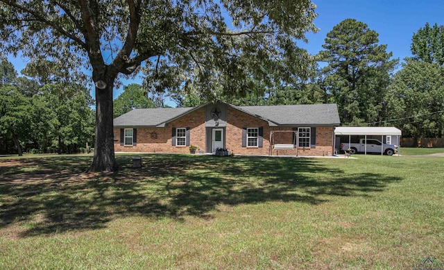 ranch-style home featuring a carport, brick siding, and a front lawn